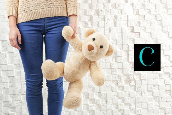 a child holding a teddy bear