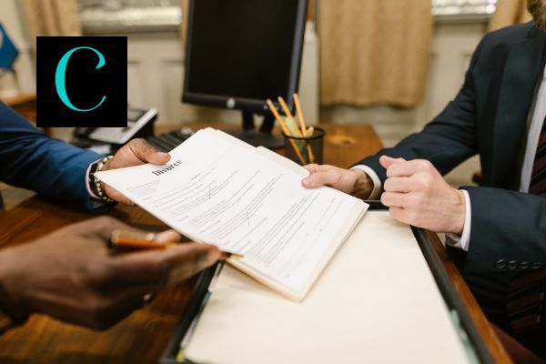 two lawyers discussing divorce paper work