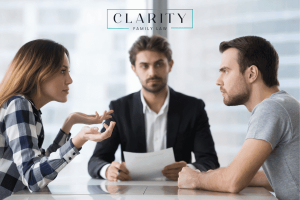 Irritated man and woman during a discussion with a divorce attorney