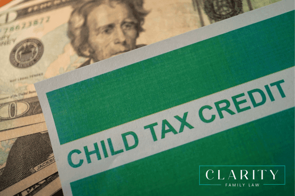 Child tax credit forms in front of cash.