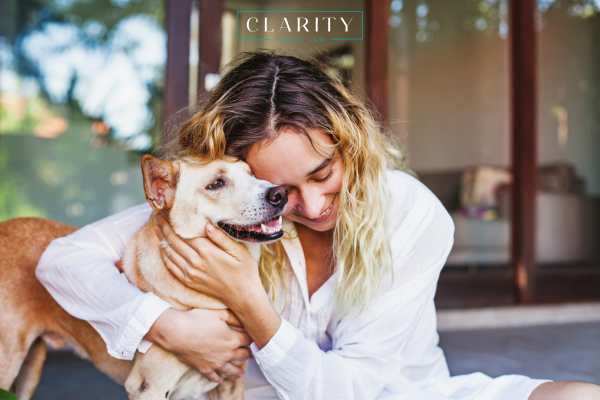 a woman holding a dog