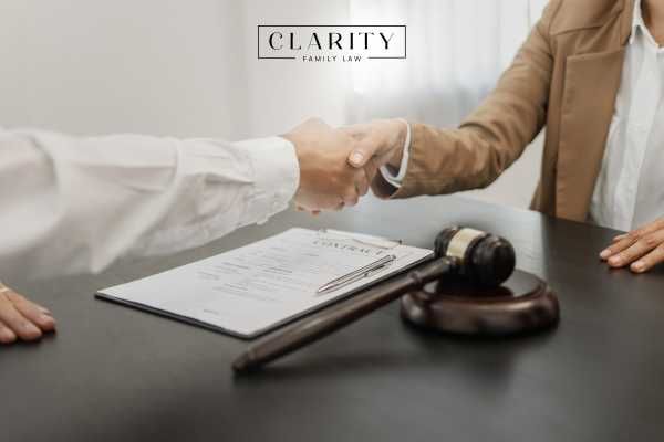 a woman meeting with a lawyer to discuss filing for divorce