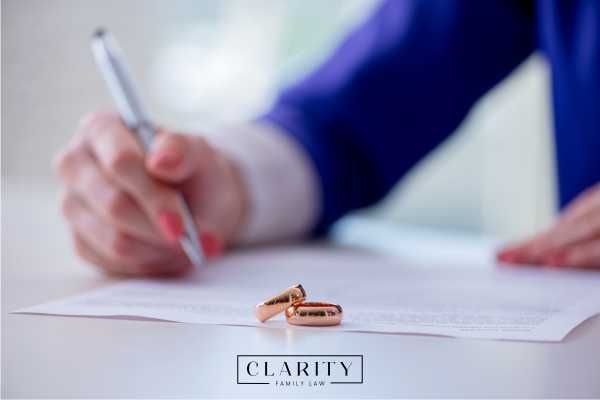 an attorney reviewing a prenup document at a desk