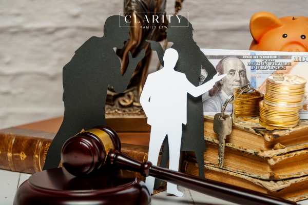 cut outs of an arguing couple arguing on a lawyers desk