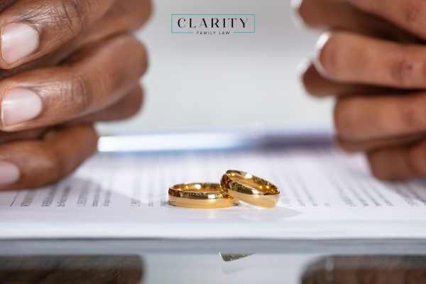 a couple signing uncontested divorce forms