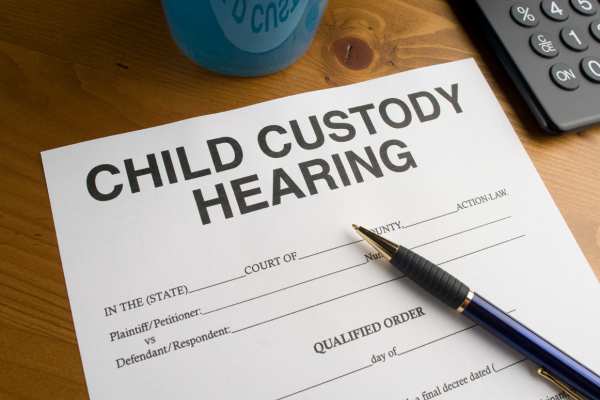 a hearing to change a custody order on a desk