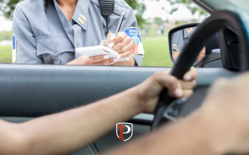a driver being written a speeding ticket