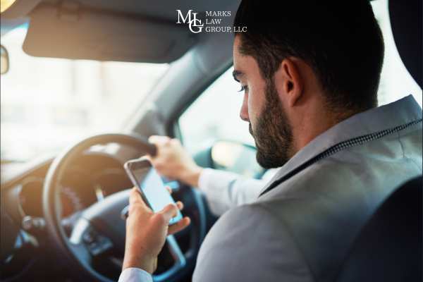 a man texting while driving