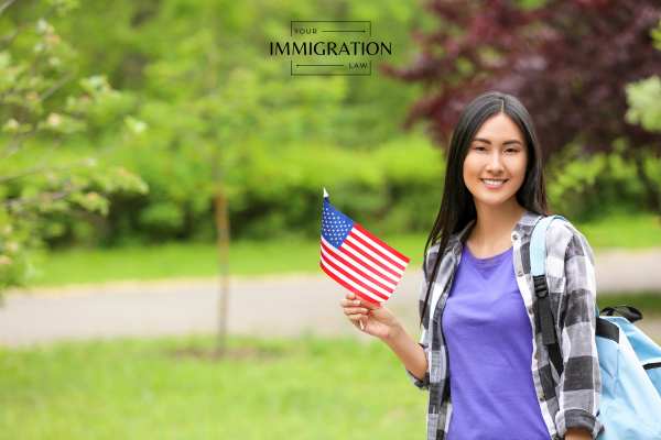 a student holding an American flag