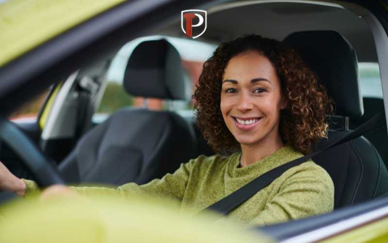 a woman driving after getting her license reinstated