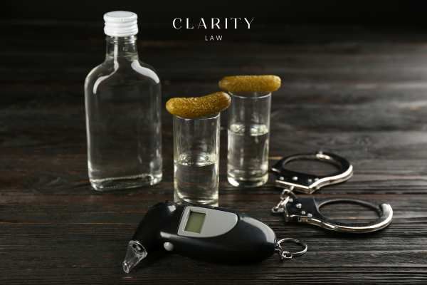 a breathalyzer test and alcohol on a table