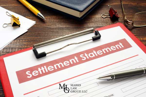 a settlement offer from an insurance company on a clipboard
