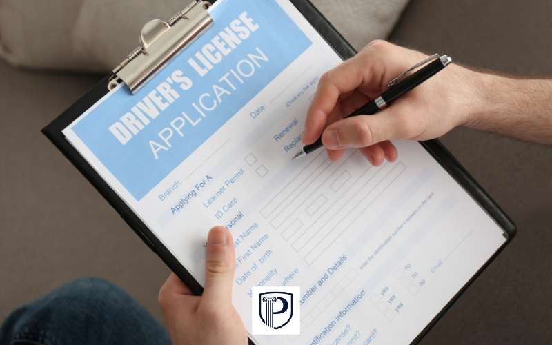 a man filling out an application for a drivers license reinstatement