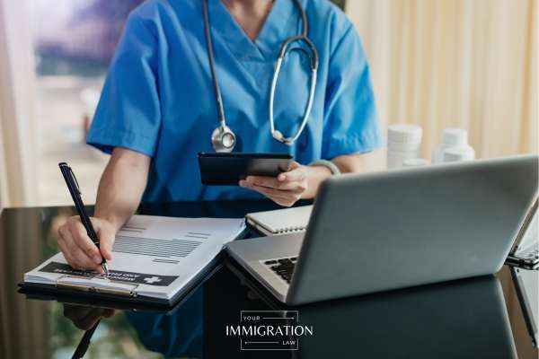 a healthcare worker at a desk
