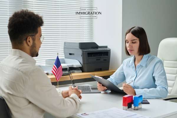 a man atte4nding an interview for a visa to get medical treatment
