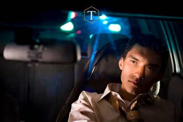 a man being pulled pver at night for suspicion of drunk driving