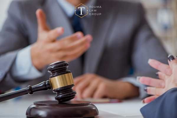a woman meeting with a criminal defense attorney