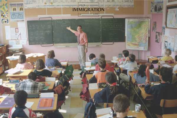a man teaching a class full of students