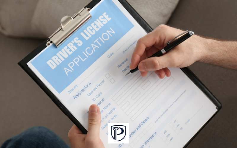 a person filling out a drivers license reinstatement form