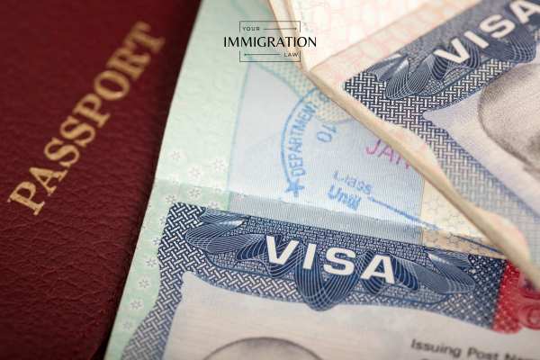 an immigration visa and passport on a table