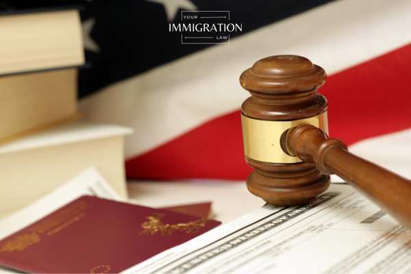 a gavel and passport in front of an american flag