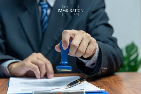 an immigration official approving a visa