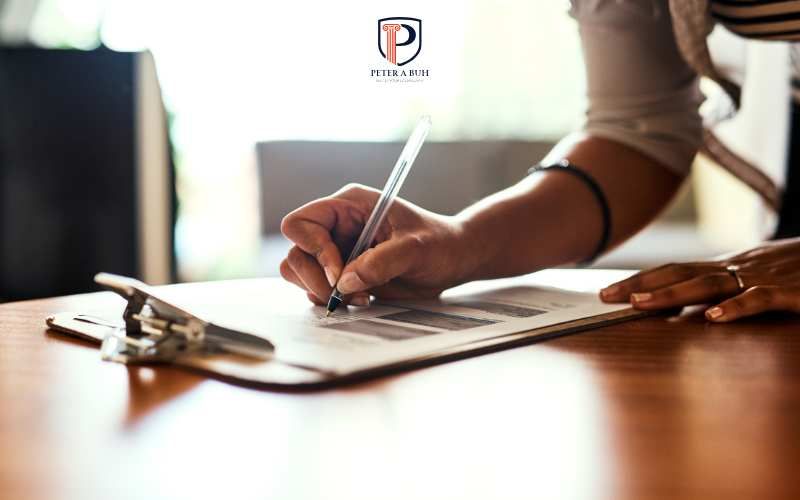 a woman filling out documents for license reinstatement