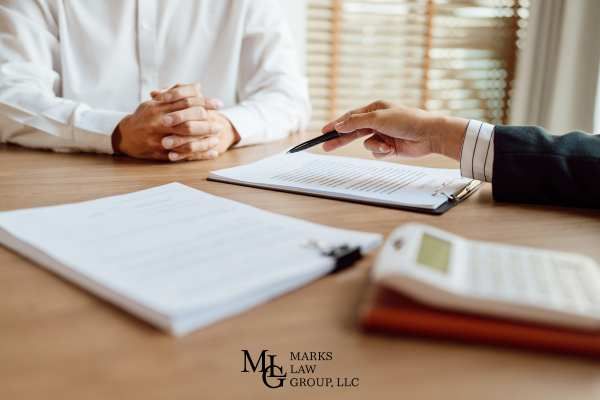 an attorney discussing a settlement offer for an injury claim with a client
