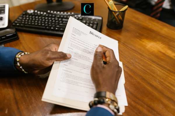 a man reviewing and signing divorce papers