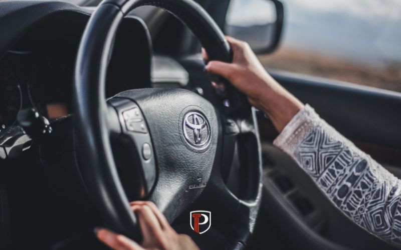 a woman with a restricted driving permirt in a car