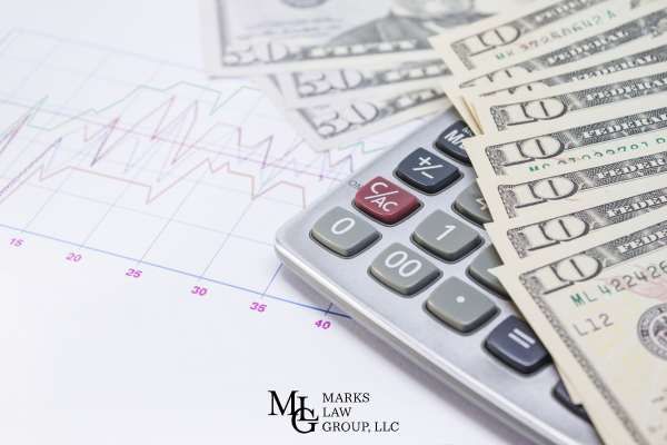 medical bills and money on a table