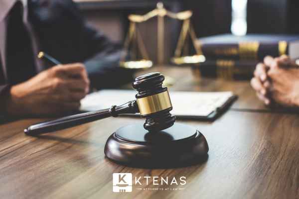 a man discussing charges with a defense lawyer during a consultation