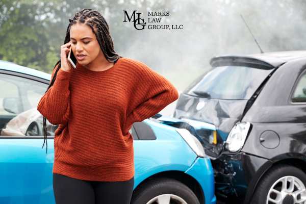 a woman calling the police to report a car accident