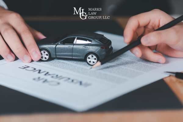 a man reviewing a car insurance policy
