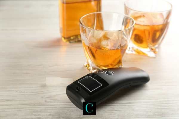 alcohol and a breathalyzer test on a table