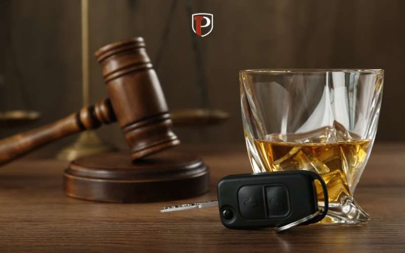 a judge's bench with a gavel, car keys, and alcohol on it