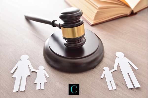 a cut out of a family being split by a gavel