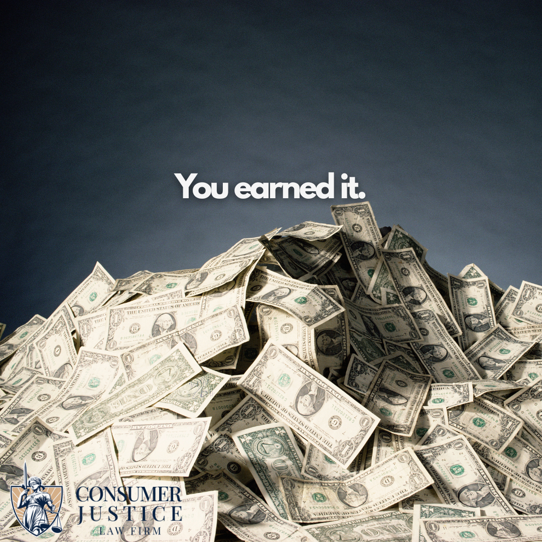 A large pile of dollar bills stands in a heap on a desktop with the words "You earned it." The Consumer Justice Law Firm logo appears in the lower left corner. The image conveys the sense that working with a labor law violations lawyer is a smart way to protect your rights to the wages you earn.