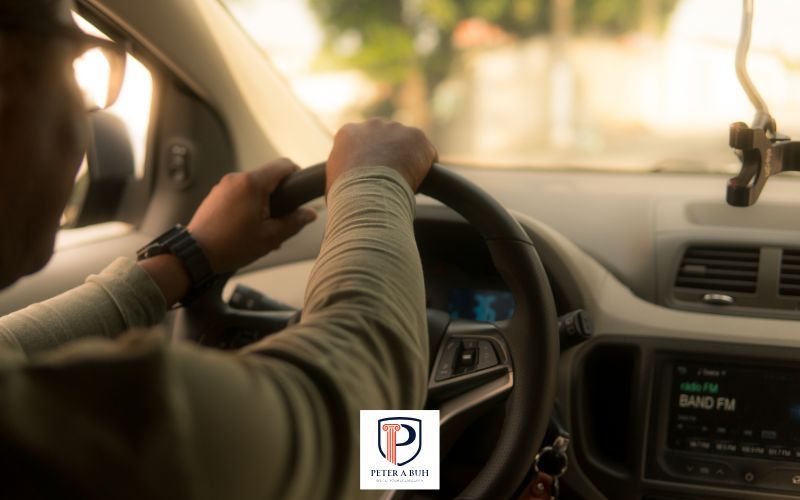 a man driving a car after getting his license reinstated