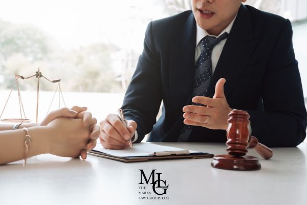 an attorney discussing an injury claim with a prospective client