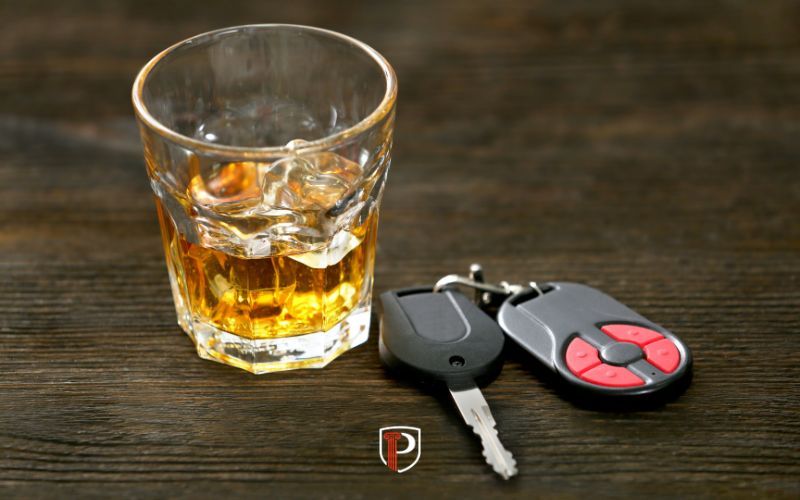 car keys and alcohol on a table