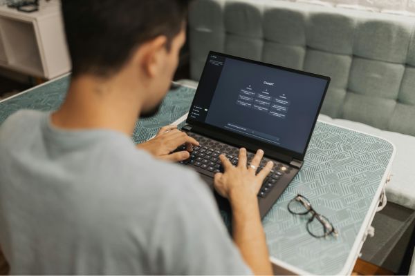 guy working on laptop using ChatGPT