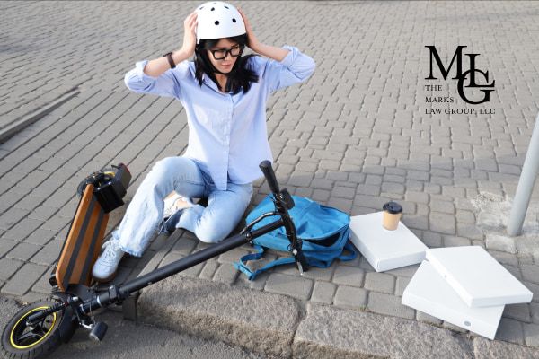 woman on the ground after an e-bike accident