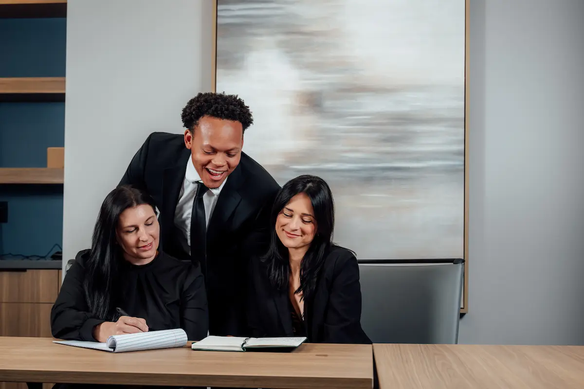 Raburn Kaufman attorneys and staff gathered around a conference table