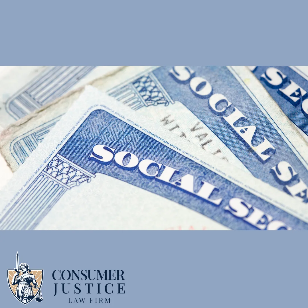 Social security cards lay spread out on a desktop. The Consumer Justice Law Firm logo appears in the bottom left corner. In the context of the article, the image conveys the importance of correcting employment background check errors related to Social Security numbers.
