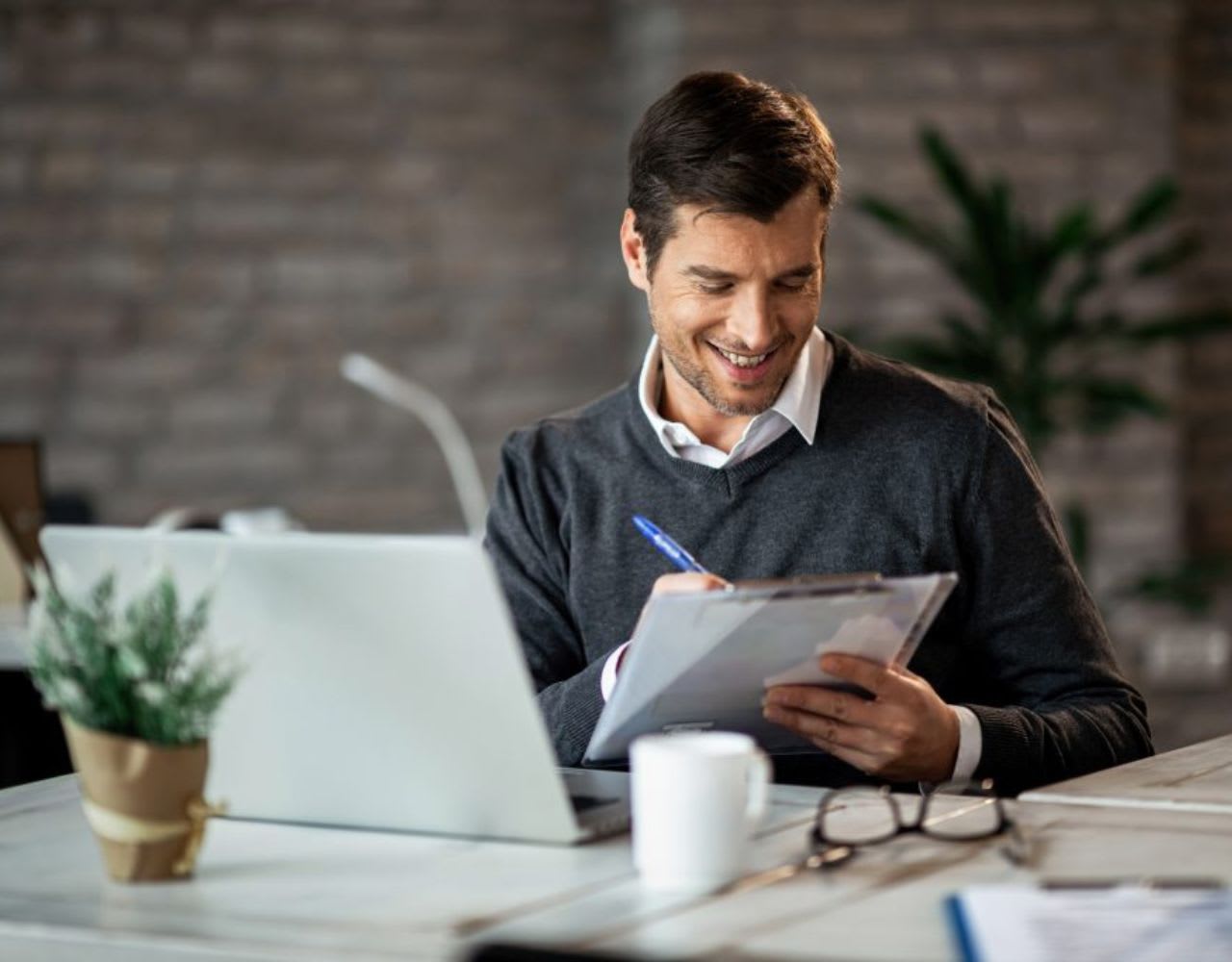 male gathering documents for his credit report