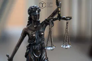 a model statue of lady justice on a desk