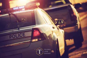 a police officer pulling over a driver in a pickup for suspicion of DUI