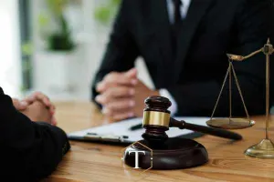 a man discussing an assault charge with a lawyer