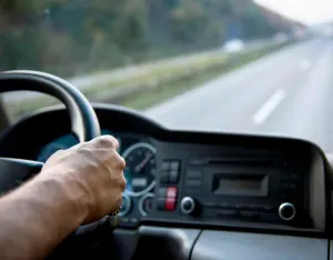 a CDL holder driving a truck on a road